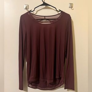 lululemon long sleeve workout top in a size 4! I would say it runs a bit big.